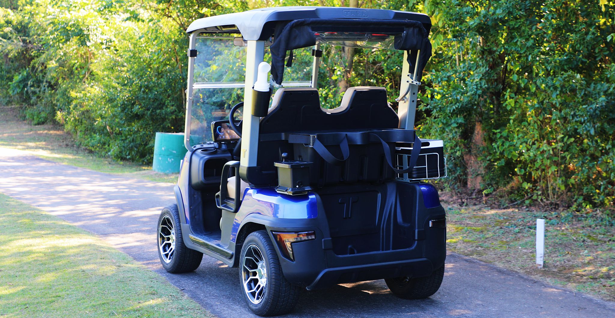 TARA Neighborhood Electric Vehicles Driving on Golf Course
