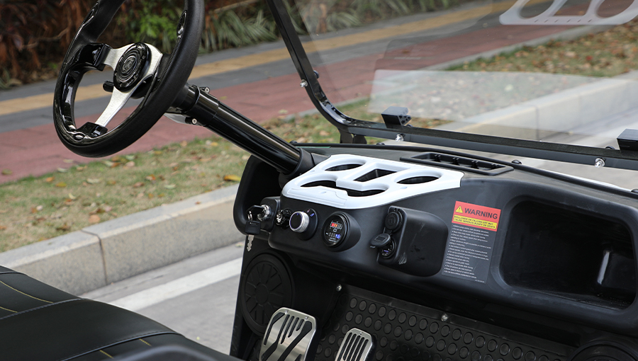 Close-up of Tara golf cart dashboard featuring digital speedometer, battery indicator, and control switches