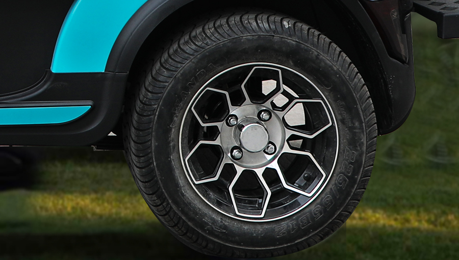 Close-up of Tara golf cart 12-inch aluminum wheel paired with a radial tire, offering strength and smooth ride performance