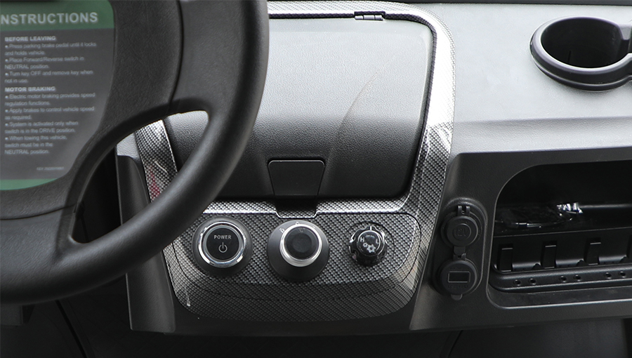 Interior view of Tara golf cart showing well-organized control switches within reach of the driver