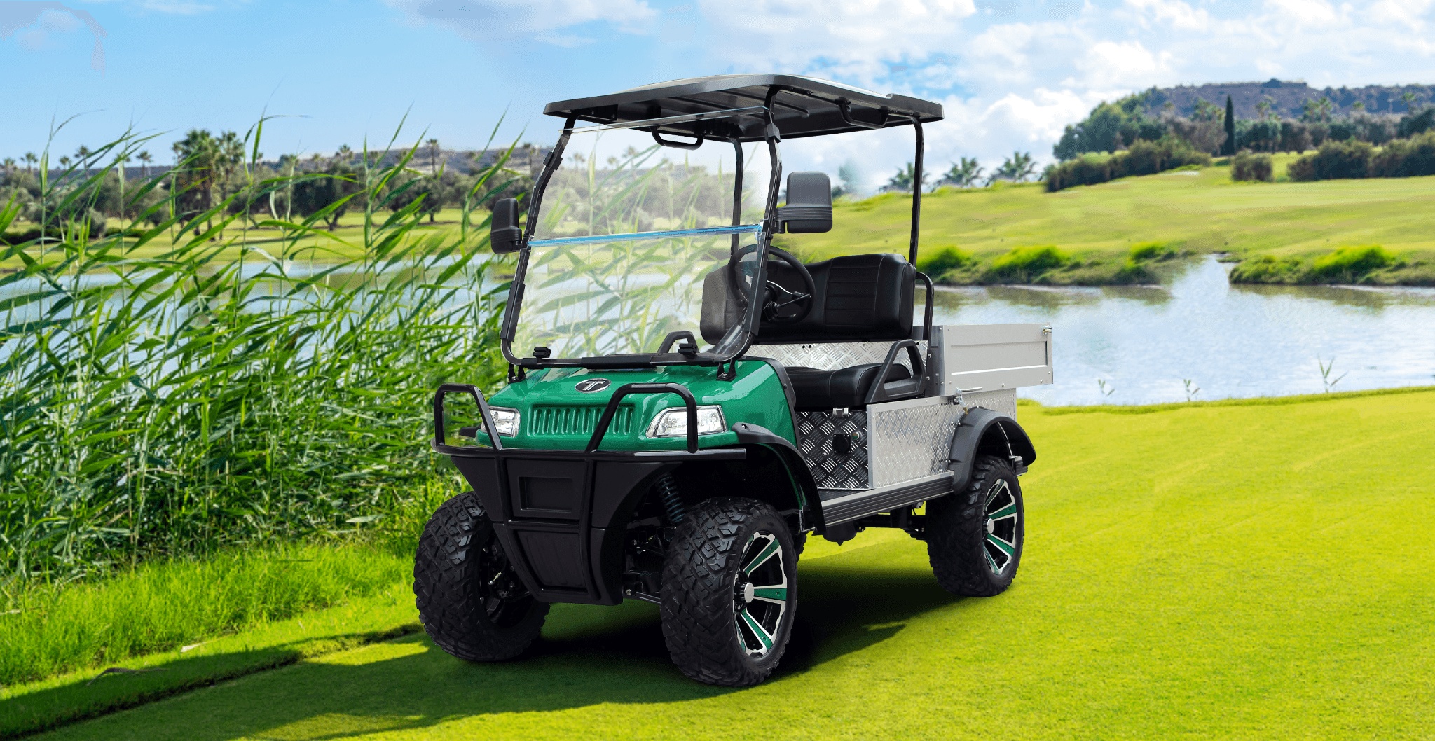 Turfman 700 Electric UTV Operating on Grass Field